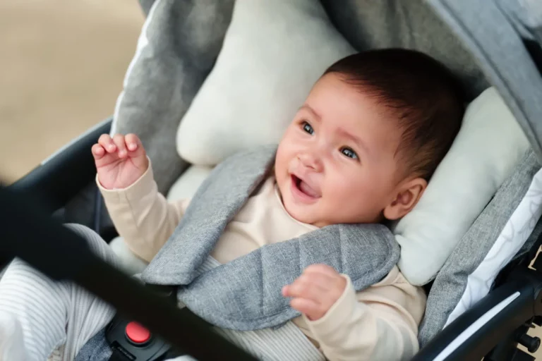 Essential Post-Adoption Support: Providing comprehensive assistance for families. A happy baby in a car seat symbolizes the joy of a well-supported journey.