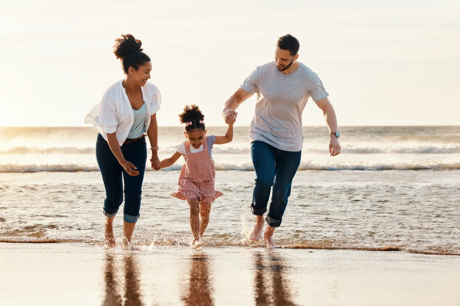 Adoption Birth Mothers: Cherishing Joyful Moments – A Happy Family Playing on the Beach Shoreline.